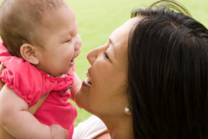 smiling mother and baby